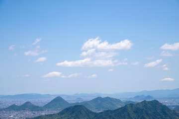 Fototapeta na wymiar 讃岐平野の山々と青空（香川県高松市）