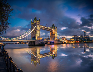 Tower Bridge  at dusk illuminated and reflected in Thames river