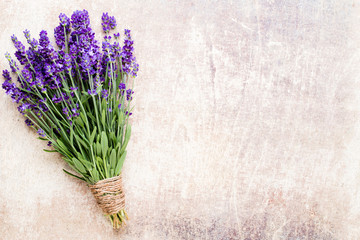 Lavender flowers, bouquet on rustic background, overhead.