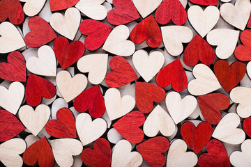 Background with wooden hearts, place for text