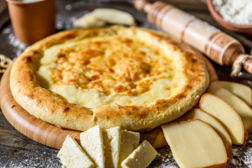 Traditional Georgian khachapuri on the table. Homemade baking