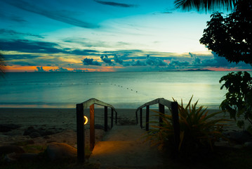 Enjoying sunset time in Denarau Island Fiji with orange blue sky and cloud for family vacation and...