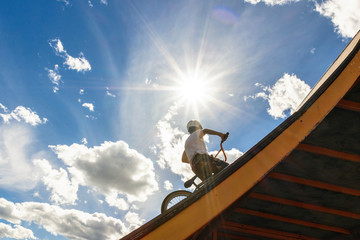 bmx cyclist preparing for a stunt on a Sunny day