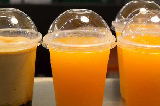 Orange juice in plastic glass