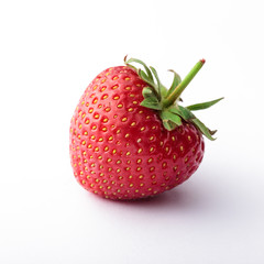 Strawberry fresh slanted closeup isolated on white background bright light
