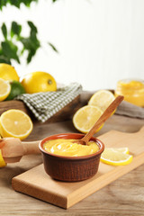 Obraz na płótnie Canvas Delicious lemon curd in a bowl on the table