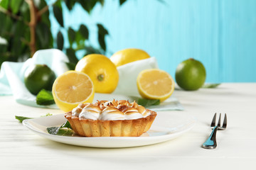 Lemon pie on a table on a blue background