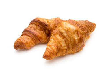 Tasty buttery croissants on the white background.