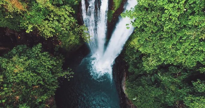 Aerial drone view of beautiful Aling Aling waterfall in nothern Bali, Indonesia