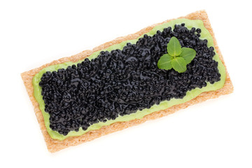 Canapes with black sturgeon caviar and  spice isolated on the white background.