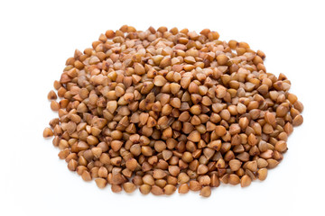 Buckwheat grains isolated on the white background.