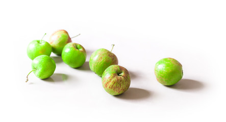 Organic fresh green apples arrangement isolated on white background