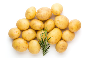 New potato and rosemarin isolated on white background close up.