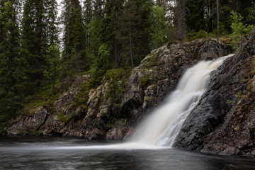 Fototapeta na wymiar Komulankongas waterfall in Hyrynsalmi, Finland.