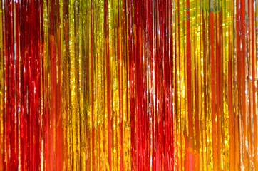 shimmer shiny tinsel red yellow and orange background