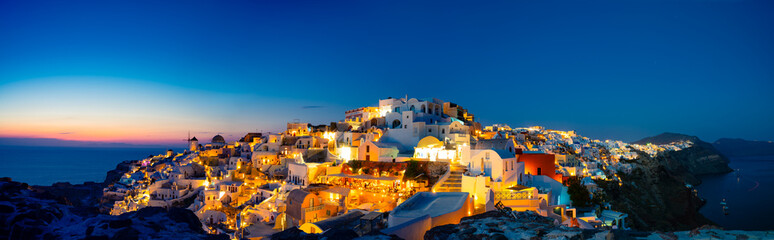 Panoramic view of Oia town before sunrise, Santorini island, Greece