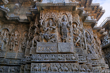 Sculpture of dancing Shiva on the centre left and Vishnu on the right, west side walls, Hoysaleshwara temple, Halebidu, Karnataka. view from West.
