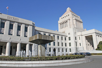 The unique, classic granite central tower of the National Diet Building of Japan, the meeting place of the national government, rises into a blue sky in Tokyo. National diet building -Kokkaigijido