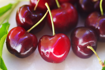 red cherry berries isolated on table