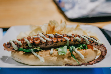 Sandwich with an octopus tentacle. Sea food