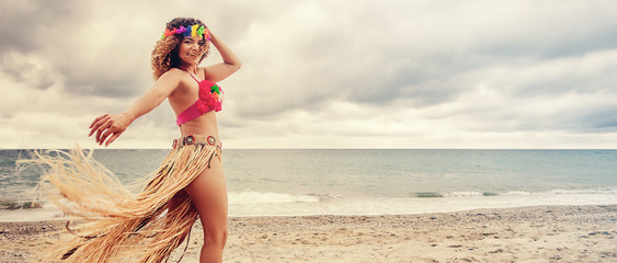 Beautiful hawaiian woman portrait dancing on the beach, letterbox