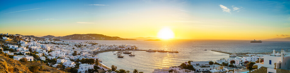 Panoramic view over Mykonos town at sunset - obrazy, fototapety, plakaty
