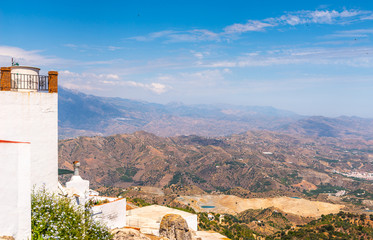 Obraz premium beautiful view of the mountains in the region of Andalusia, houses and farmland on the slopes of mountains