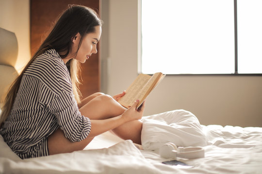 Pretty girl reading a book