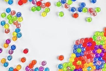Background of colored beads on a white background