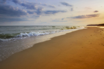 beautiful yellow sandy beach near the blue sea