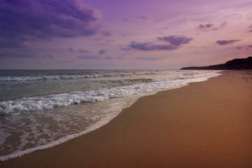 Fototapeta na wymiar yellow sand beach near the blue beautiful sea