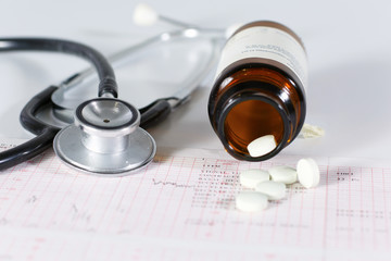 stethoscope, pills, vials in medical room on blue background top view mockup