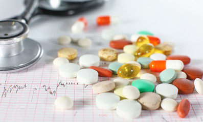 stethoscope, pills, vials in medical room on blue background top view mockup