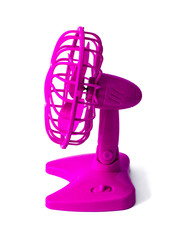 Pink plastic fan with batteries, propeller and protective grille. Side view. Isolated on white background