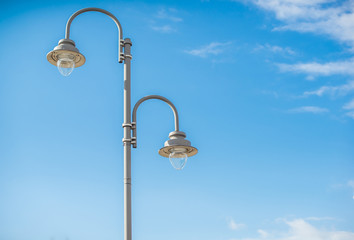 A typical lamppost on a blue sky background