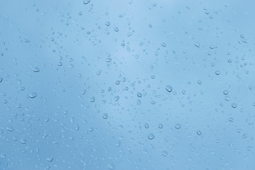 Water drops on glass - abstract background.