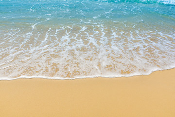 Fototapeta na wymiar Wave on the sand beach