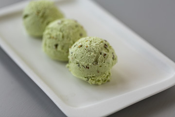 Fresh pistachio ice cream, nuts and mint.