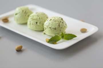 Fresh pistachio ice cream, nuts and mint.