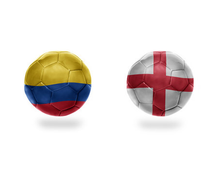 football balls with national flags of colombia and england.