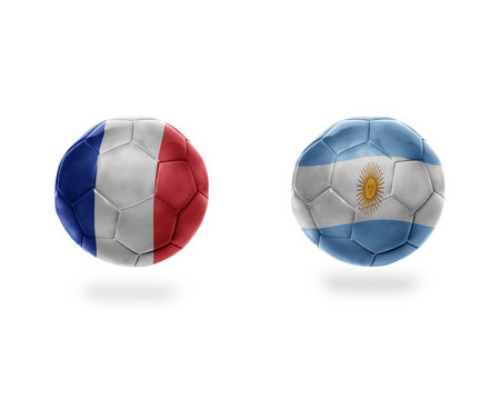 football balls with national flags of argentina and france.