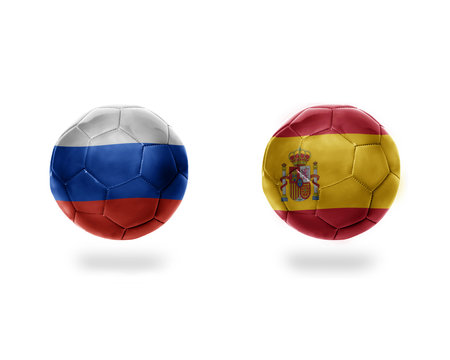 football balls with national flags of spain and russia.