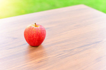 Close-Up View of Fresh Red Apple Isolated on Wooden Table