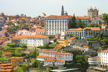 Fototapeta na wymiar Old town with of Porto with the Episcopal Palace (Paço Episcopal) view from the city Vila Nova de Gaia, Portugal