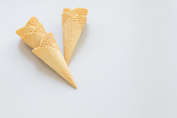 Waffle ice cream cone on a light background, with space for text.