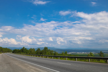 mountain landscape with a road and blue sky