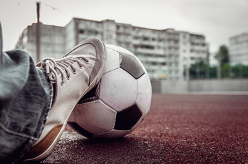 Fototapeta na wymiar foot of a man on a soccer ball