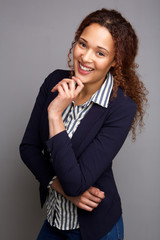 Fototapeta na wymiar businesswoman smiling against gray background