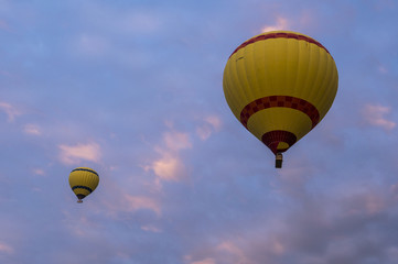 Two Yellow Hot Air Ballons in the Sky