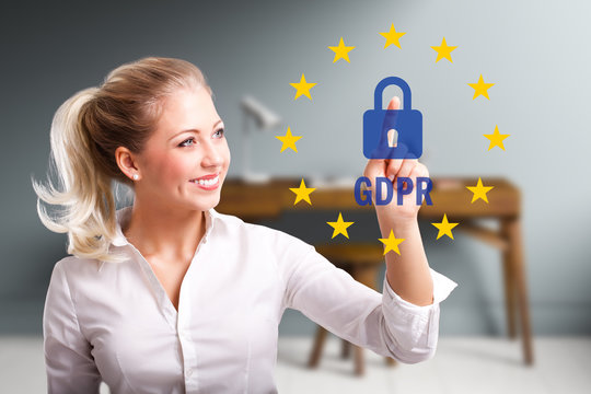 young woman is selecting GDPR in front of an office desk